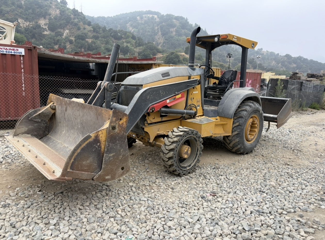 John Deere 210LE skip loader ready for landscape equipment repair and service