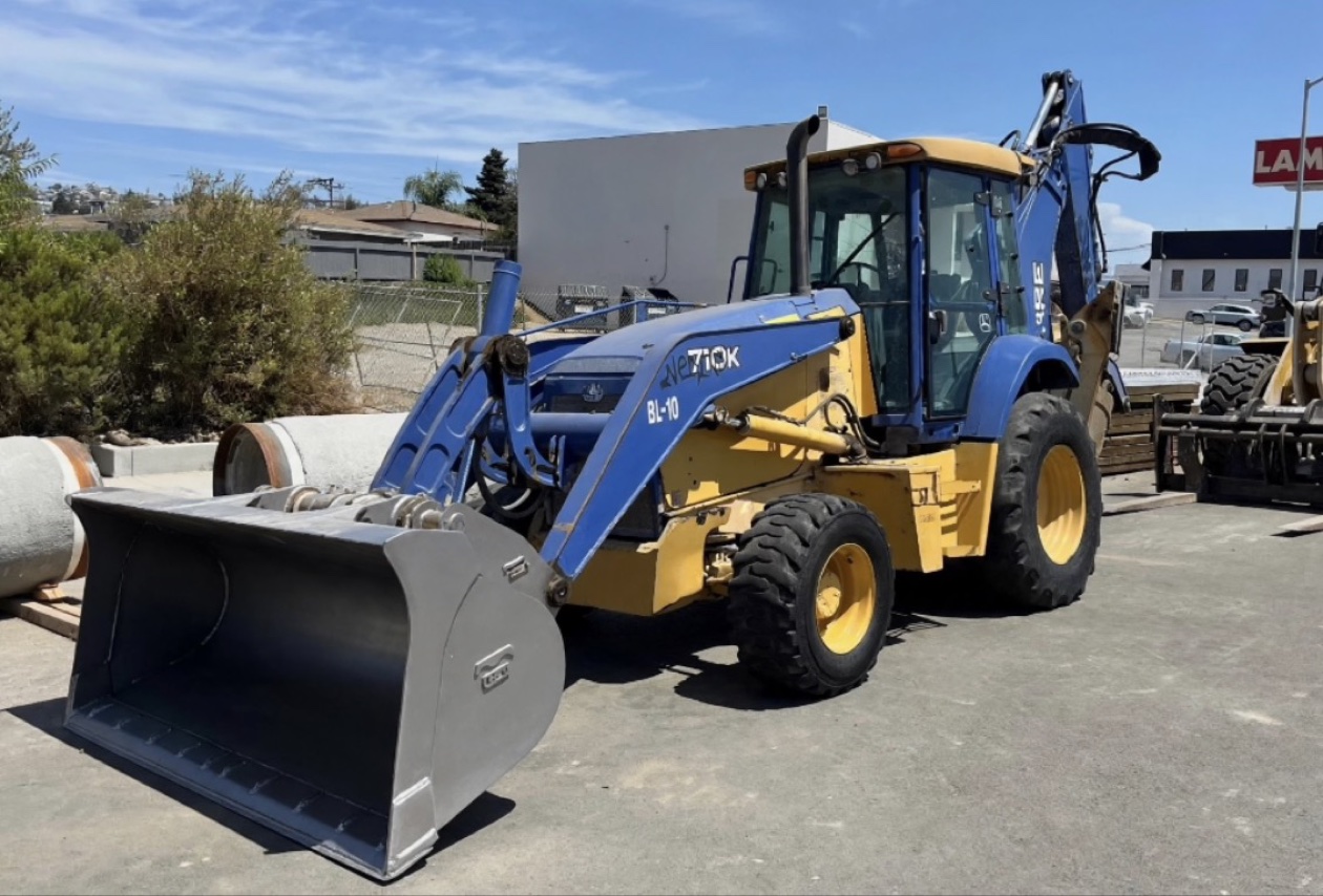 New Holland 710K backhoe loader serviced by LA Trucks and Tractors