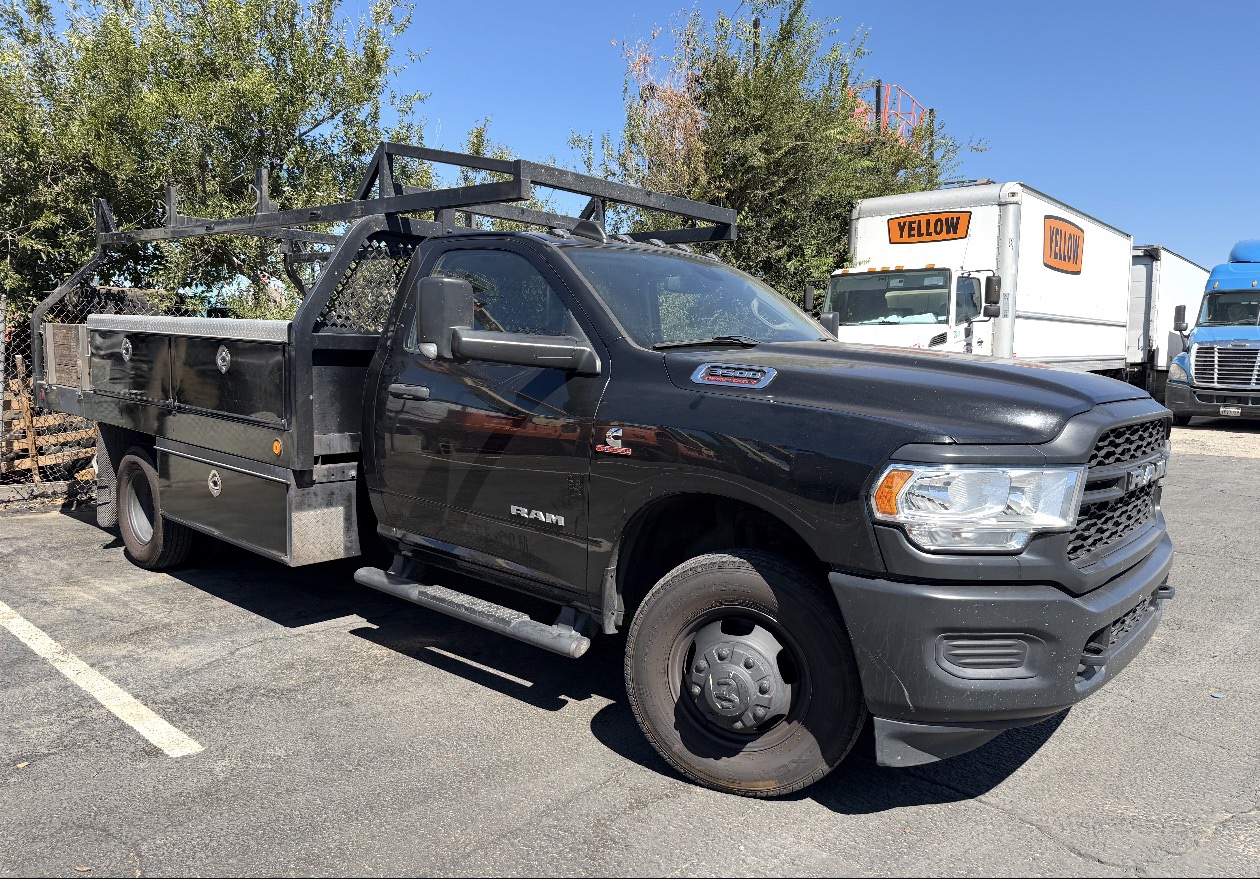Ram 5500 with custom flatbed and ladder rack available for nationwide purchase